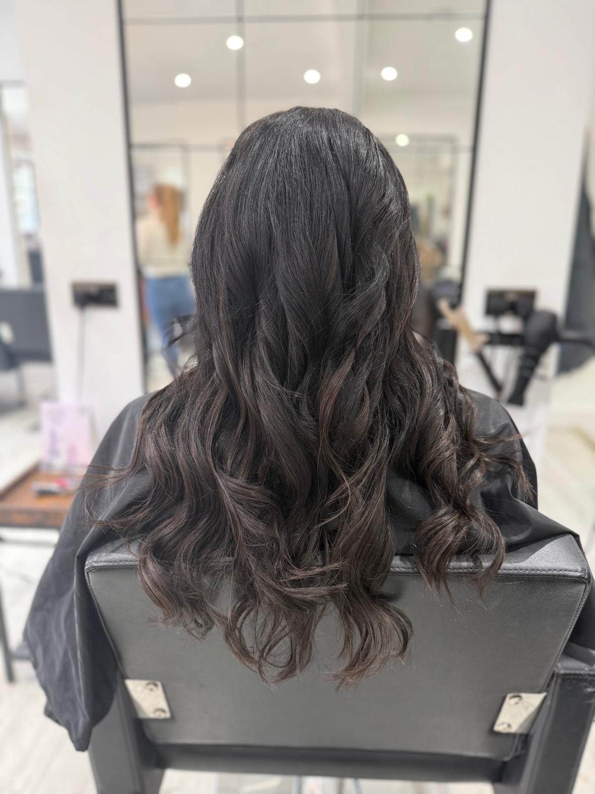 After photo of glossy dark brunette waves by Rebecca Jane Hair