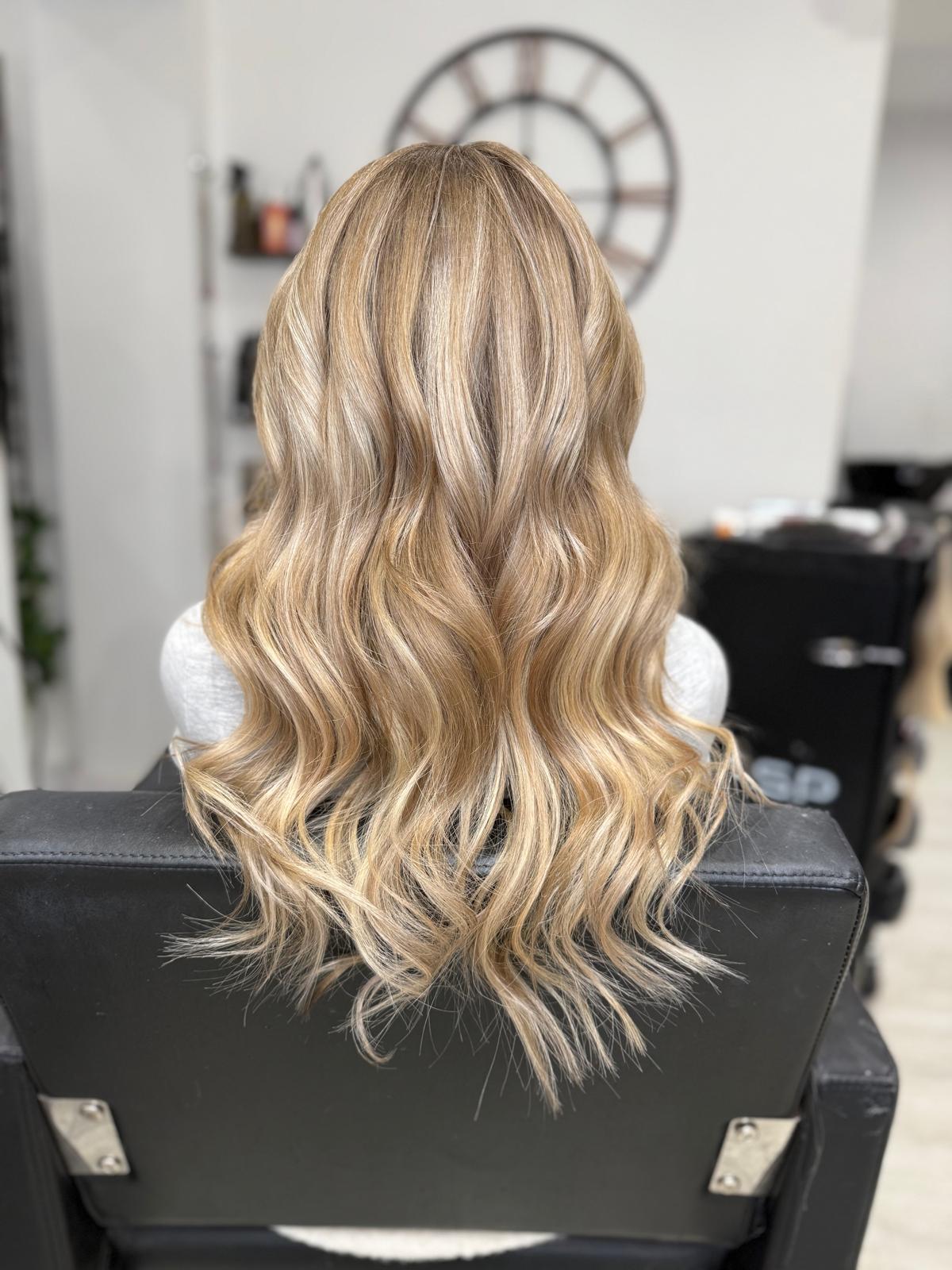 After photo of champagne blonde waves by Rebecca Jane Hair
