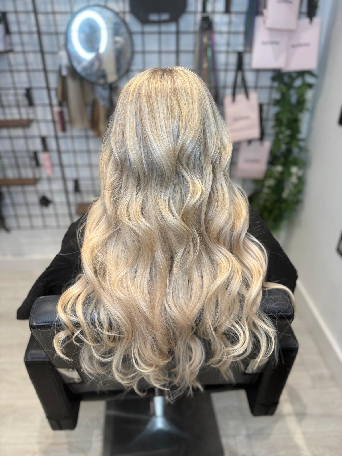 After photo of bright blonde waves by Rebecca Jane Hair