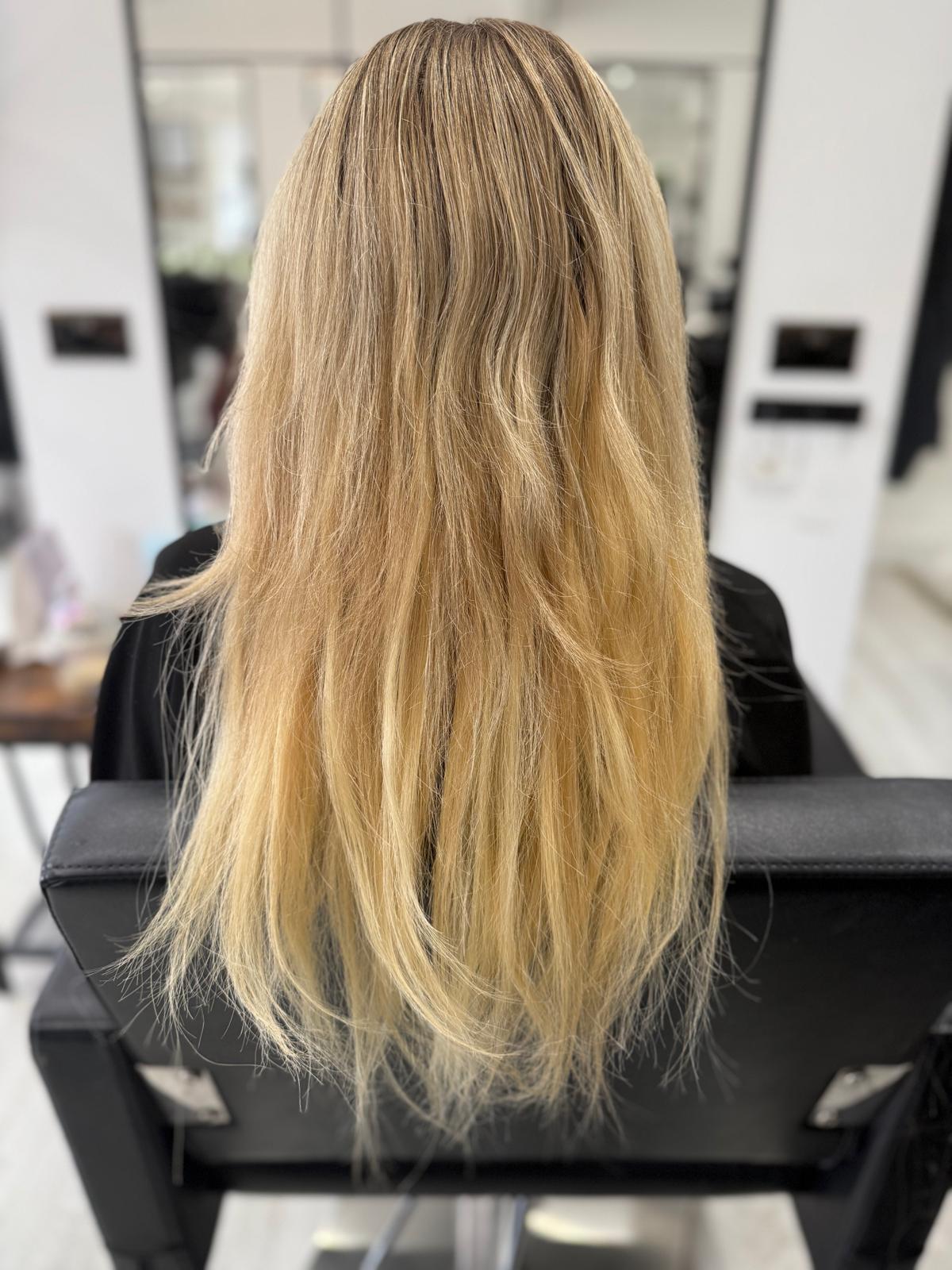 Before photo of long blonde hair before a Rebecca Jane Hair appointment